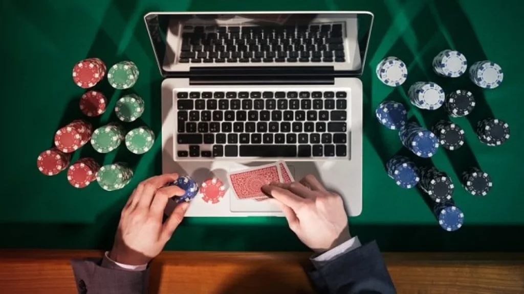 a person playing poker with chips and cards